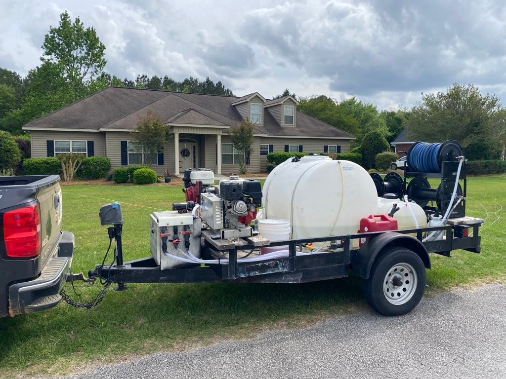 pressure washing trailer in front of residential house